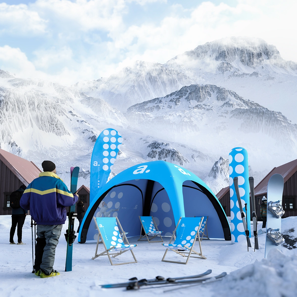 Winter promotional zone adsystem with blue pneumatic tent, deckchairs and advertising flags against a backdrop of snow-covered mountains